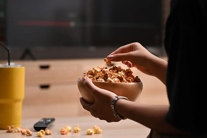 The-Hand-of-a-Snack-Eating-Woman